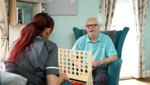 video marketing for care care home team member interacting with care home resident